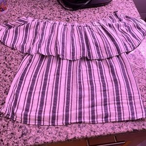 “Sleeveless” top with sleeves, ruffles go all the way around shoulder line.